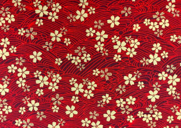 Dekostoff , goldene Blüten, rot